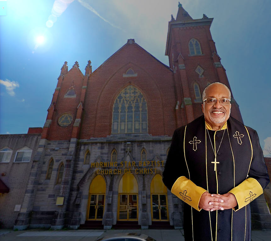 Pastor Fowler in front of church